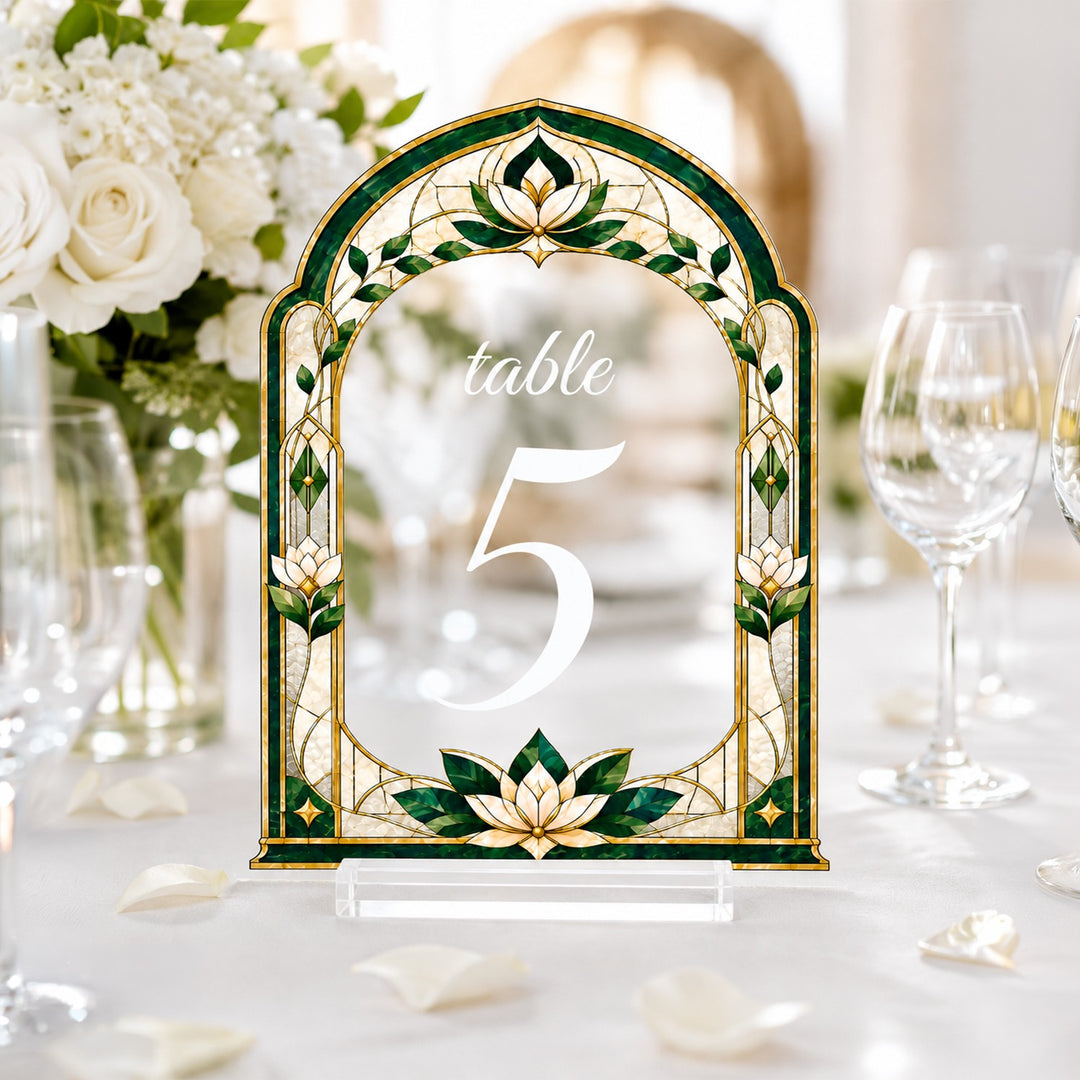 Decorative table number with floral design on a table setting. Emerald Green Stained Glass Wedding Table Numbers. Clear acrylic wedding table sign.