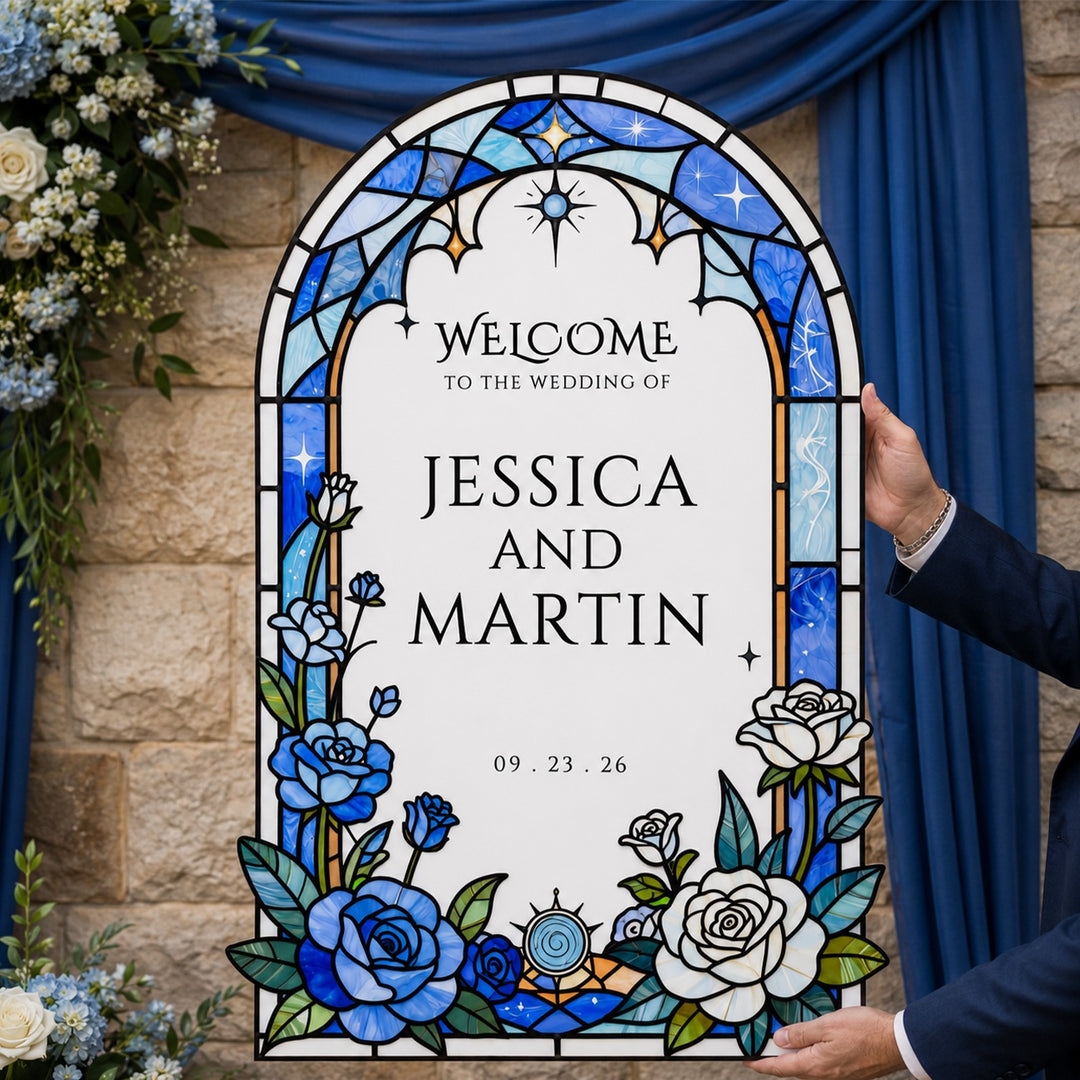 Decorative wedding sign with stained glass design, flowers, and text 'Welcome to the wedding of Jessica and Martin' against a stone wall and blue curtain background. Cathedral Elegance Blue Stained Glass Wedding Welcome Sign. Stained glass wedding sign, fully customizable premium PVC.