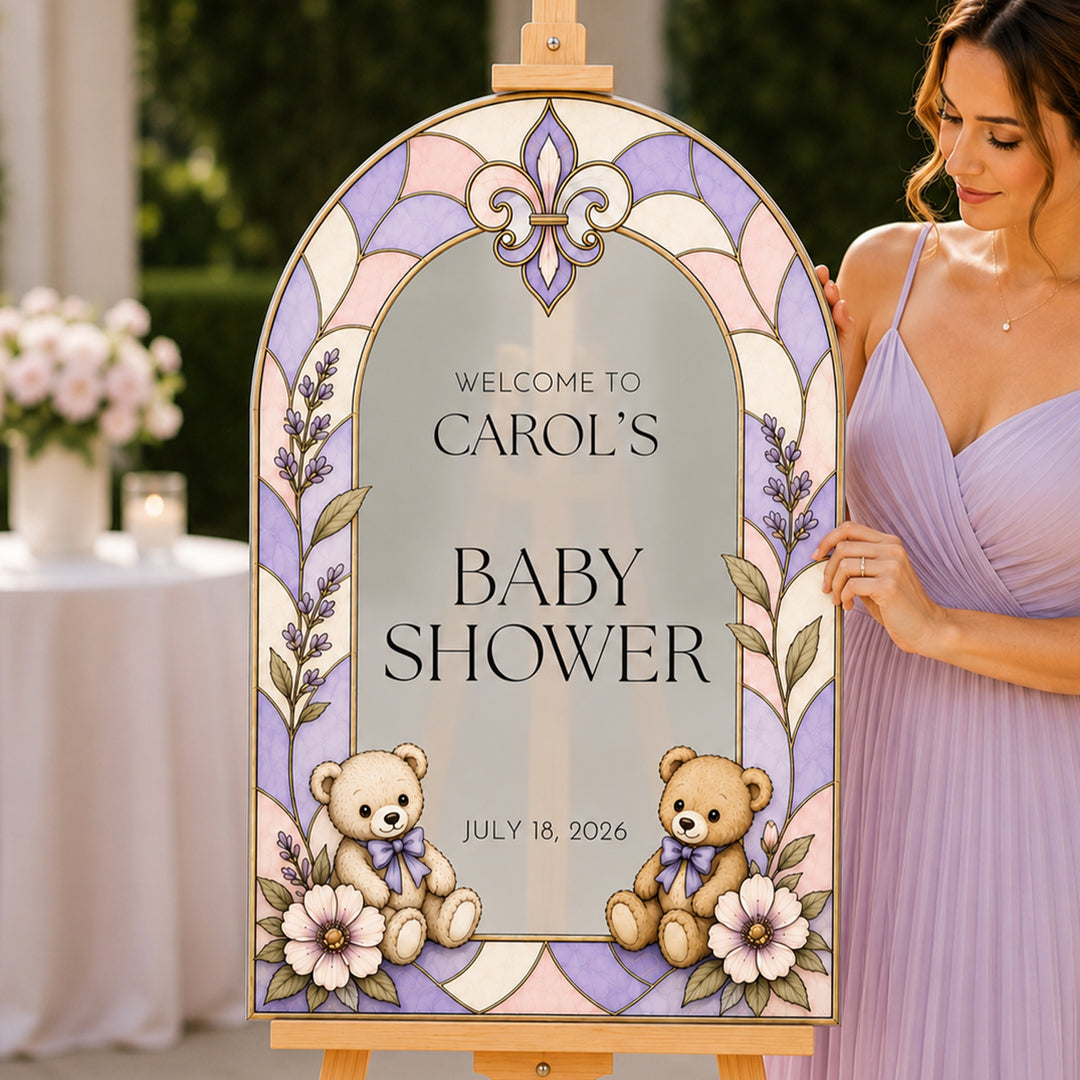 Woman holding a decorative baby shower sign with teddy bears and flowers.