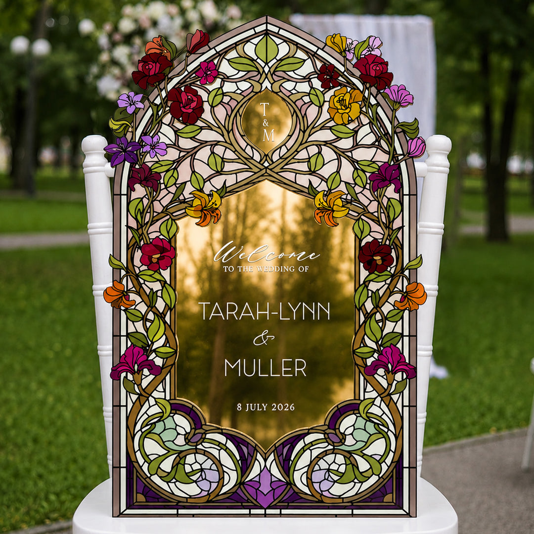 Decorative wedding sign with floral design and personalized text in an outdoor setting. Victorian Wildflowers Stained Glass Wedding Welcome Sign