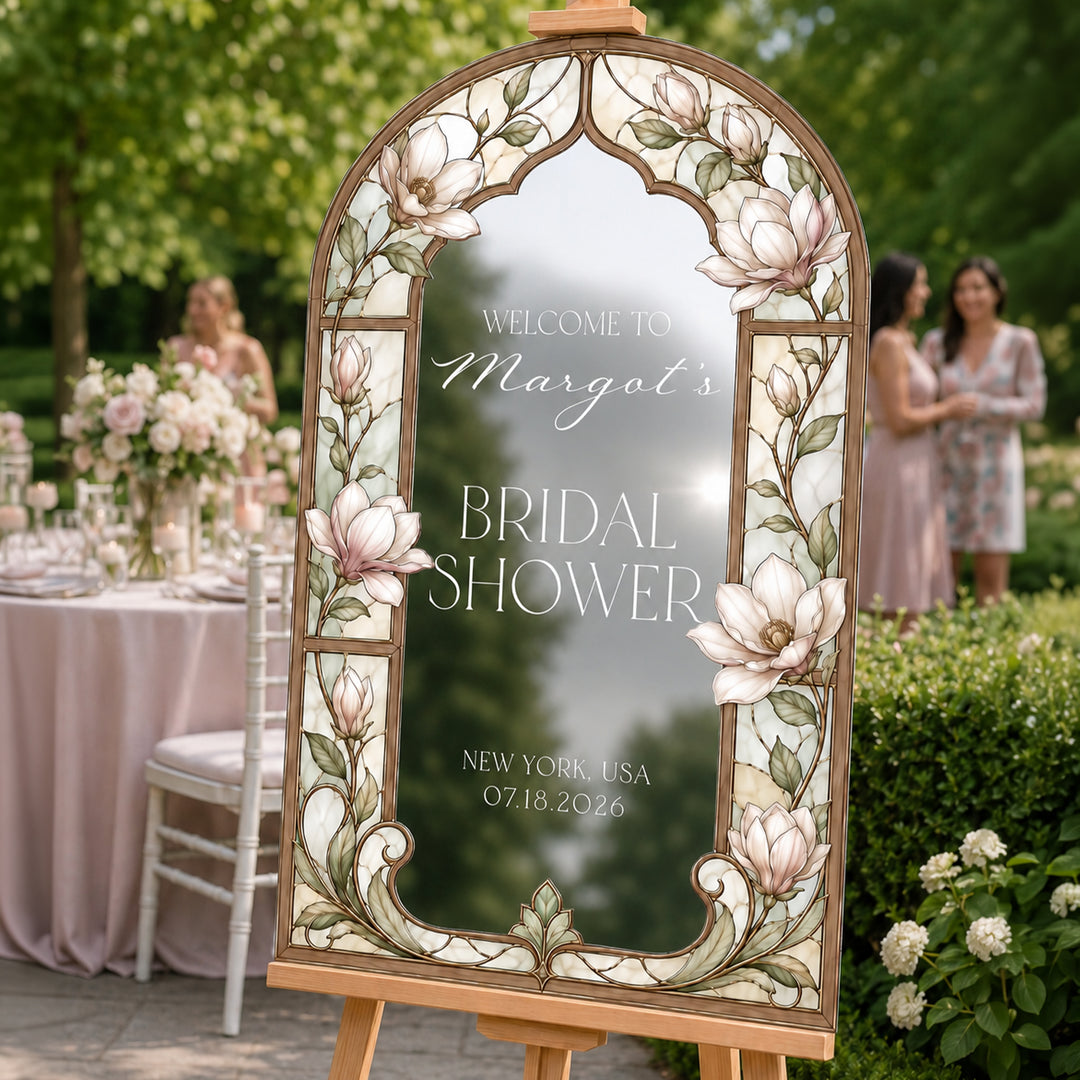 Art Nouveau bridal shower sign on silver mirror acrylic — ornate gold frame with white flowers.